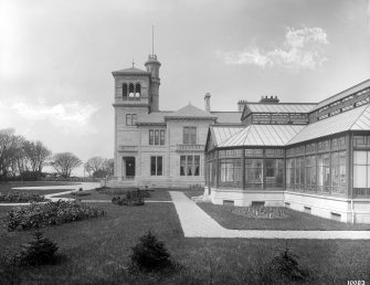 Seafield House, Ayr, view of entrance elevation with conservatory in foreground.
