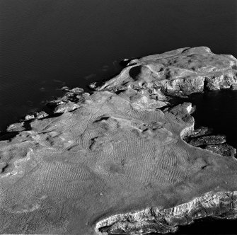 Oblique aerial view of Staffa, taken from the north, centred on building remains. Digital image of D/9581.