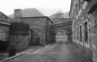 View looking NNE showing part of WNW front of Engineer's Shop with Dyeworks on left