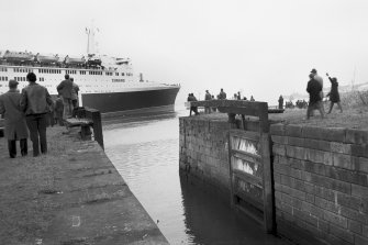 View looking W showing QE II on River Clyde with lock in foreground
