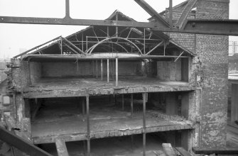 View showing roof trusses and columns in old part