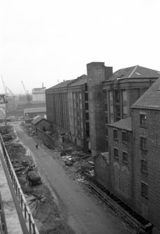 View from NNE showing part of E front of Cheapside Flour Mills with Houldsworth's Mill in background