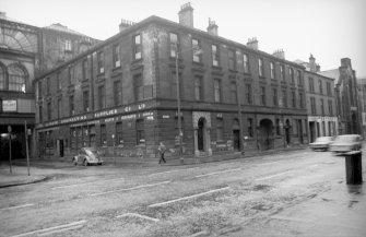 View from NW showing NNE and W fronts of warehouse with numbers 22-24 Oswald Street in background