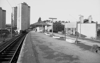 View looking NW showing SE front of station building with tower blocks on left