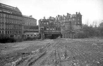 View from S showing SSE front of offices of station with part of Caledonian Mansions on right and warehouse and workshops on left