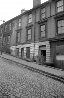 View from NNW showing NNE front of numbers 189-191 with part of tenement on left