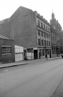 View from N showing WNW front and part of NNE front of Warehouses and Counting Houses with 280 George Street in background