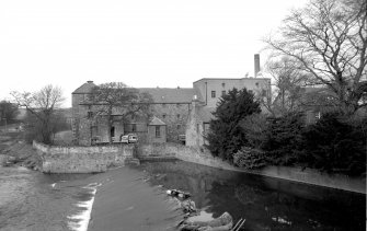 View looking NNW showing part of weir with mills in background