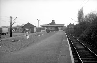 View from NNE showing NNE front of platform building with goods shed on left and signal box on right