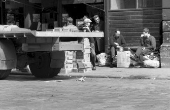 View showing street scene round fruit market