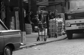 View showing street scene round fruit market