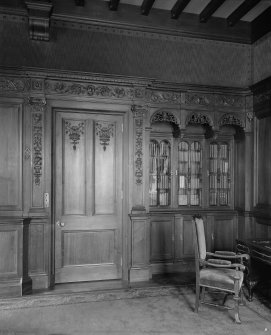 Interior - view of door and bookcase in library
