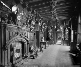 Interior-general view of Entrance Hall showing armoury and fireplace. Digital image of B/66457.