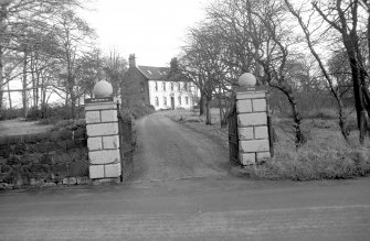 View from WSW showing WSW front of gatepiers with house in background