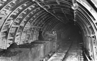 Underground, view of diesel locomotive in West Mine. No date