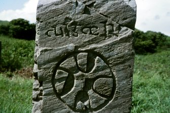 Copy of colour slide showing detail of "Cudgar" slab no.6 - close up showing inscription
Ardwall Island, Dumfries and Galloway
NMRS Survey of Private Collection
Digital Image Only