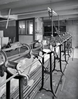 Interior view of the carpet sewing machine in the main block on the first floor of C&J Brown's warehouse.