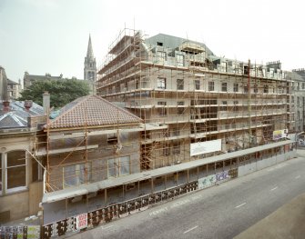 General oblique view of the front of the building in the late stages of construction seen from the North.