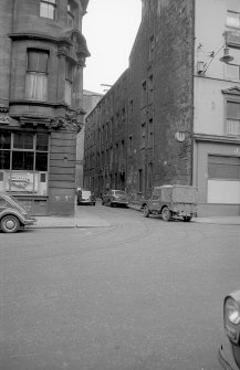 View from ESE showing S front of workshops with part of numbers 77-81 Robertson Street on right and part of numbers 71-75 Robertson Street on left