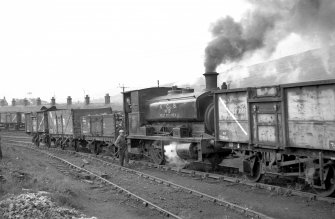 View from NW showing trucks and NCB locomotive number 19 near bridge and washery (not in picture)