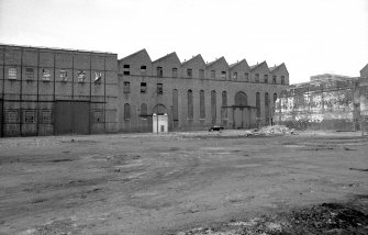 View from SE showing ESE front of engineering works with part of boiler works workshop on left