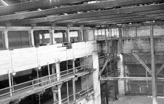 Interior
View showing side gallery with part of stanchion, strainer truss and sliding doors in background