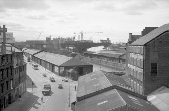 View looking WNW from Randolph and Elder Engineering Works showing SSW front and part of ESE front of Kingston Grain Mills rear extension with Kingston Dock in background