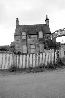 View from NE showing NE front of down platform building with part of footbridge on right
