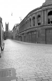 View from SSW showing WNW front (Candleriggs front) of fruit market wih church in background