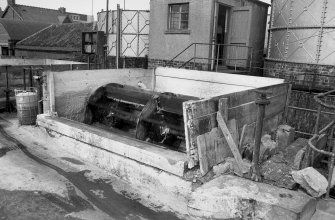 View from SW showing high washers with part of hut and acid tanks in background