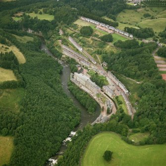 Oblique aerial view of New Lanark and the Clyde from South.