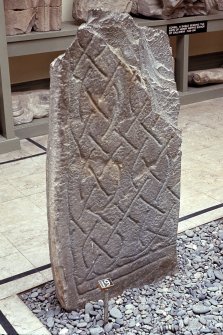Copy of colour slide showing detail of cross shaft in Whithorn Priory museum-
insc: "  Cross shaft no 19 (back) - unfinished interlace ?11 cent."
NMRS Survey of Private Collection 
Digital Image Only