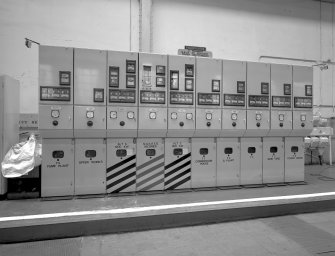 Power house: auxiliary power switchboard.  English electric 2 megawatt 6.6 KV AC auxiliary switchboard, used to distribute AC power from the two alternators to all parts of the works.
Digital image of B 13387