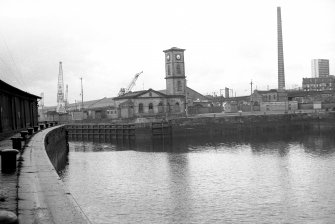 View from SE showing ESE front of west quay with power station in background and part of S quay on left