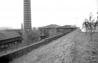 View from E showing part of chimney with main block on right and part of stable block on left