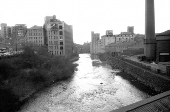 View looking WSW along River Kelvin showing Regent Mills on left and Scotstoun Mills and base of Sewage Pumping Station chimney on right