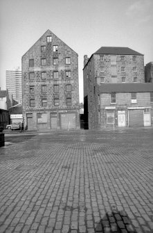 View from SSE showing SSE front of sugar refinery with part of numbers 73-75 on right