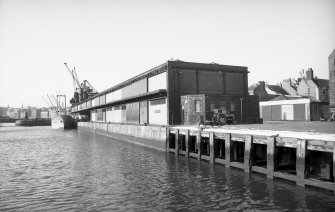 View from E showing SSE and ENE fronts of Regent Shed with part of Victoria Dock on left