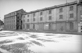 View from SE showing SSW front of E building with main building in background