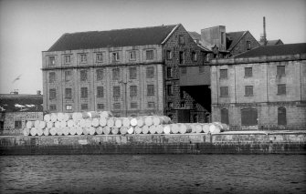 View from SE showing SSE front and part of ESE front of main building with part of E building on right