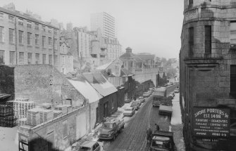 View looking ENE showing SSE front of numbers 17-37 Virginia Street with part of number 12 Virginia Street on right, warehouse/workshop, numbers 23-23 1/2 Virginia Street on left and part of numbers 10-14 Castle Terrace in background