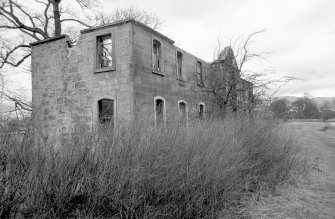 View from S showing remains of SSW and ESE fronts of stables