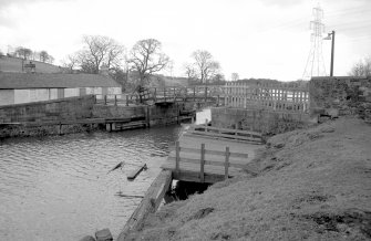 View from WSW showing W front of bridge with landing stage (used by the Fairly Queen until 1939) in foreground and part of cottages on left