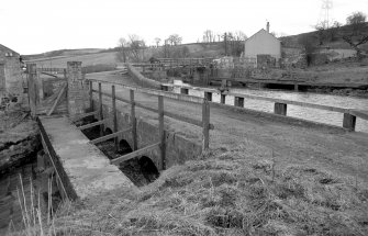 View from WNW showing N front of overflow with bridge in background