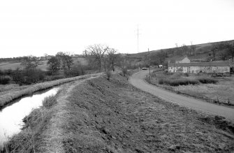 View looking SSE showing canal feeder at Craigmarloch with cottages in background