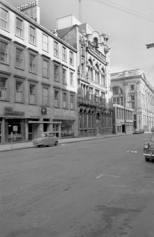 View from W showing SSW front of number 64 with number 58 in background and numbers 70-72a in foreground