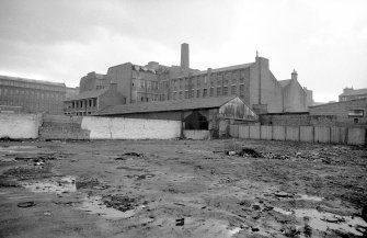 General view from ENE showing part of NNE and ESE fronts of works with part of factory and warehouses in background