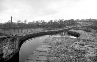 View looking SW showing part of canal with top of aqueduct in bakground