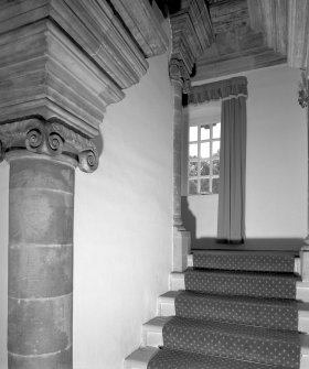 Interior. View of East wing staicase showing stone ionic columns, roll moulded steps and ashlar cornice
Digital Image of E 7397