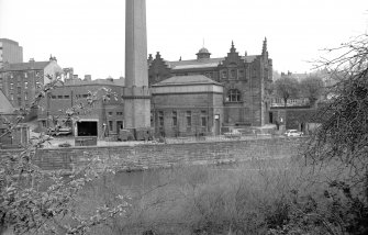 View from S showing SSW front and part of chimney